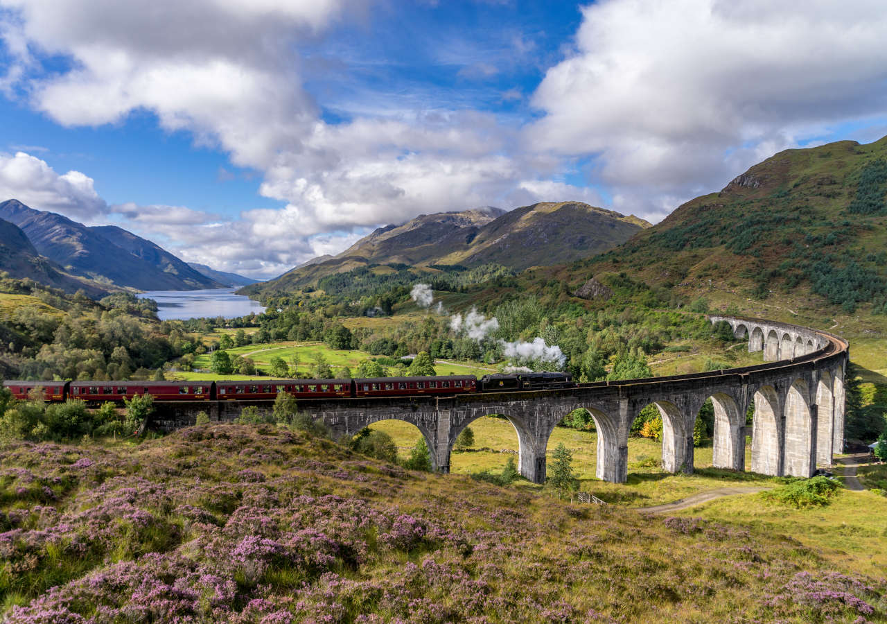 Train going across the Glenfinnan Viaduct in Scotland