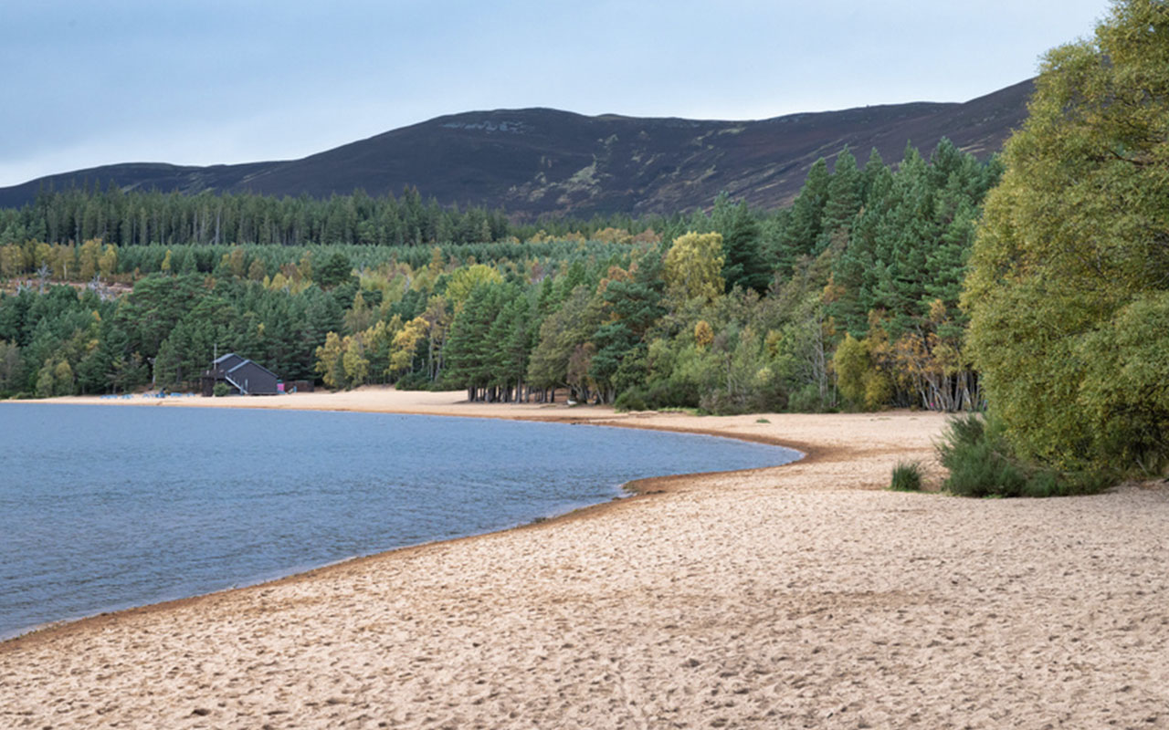 A beach by a Scottish loch