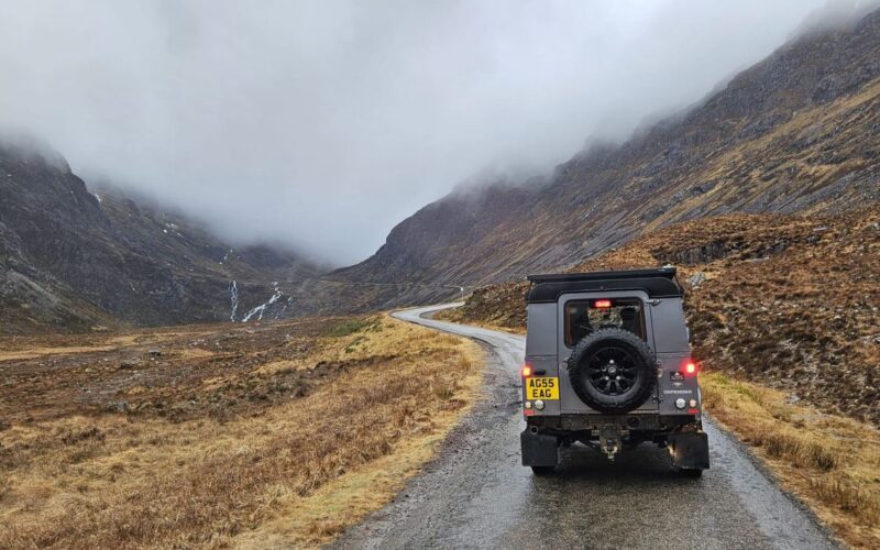 Land Rover Defender driving through Glencoe