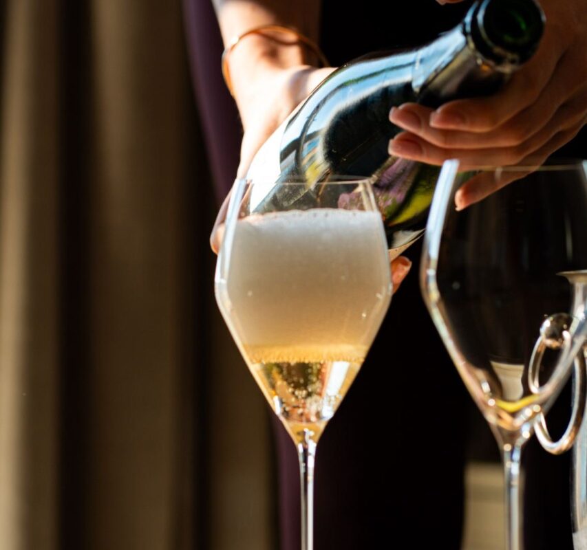 Champagne being poured at The Three Chimneys