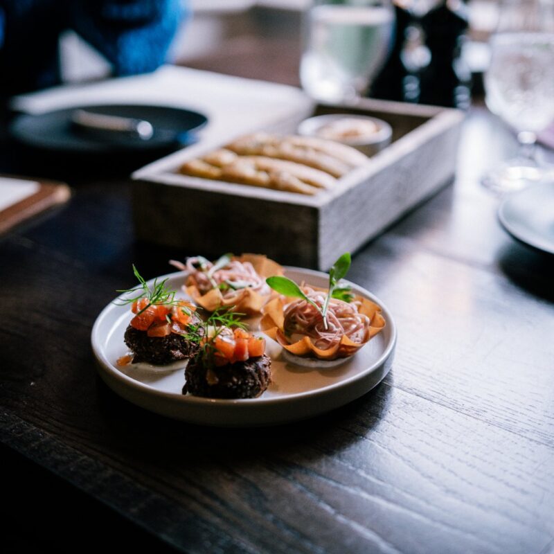 Dishes shared across a restaurant table