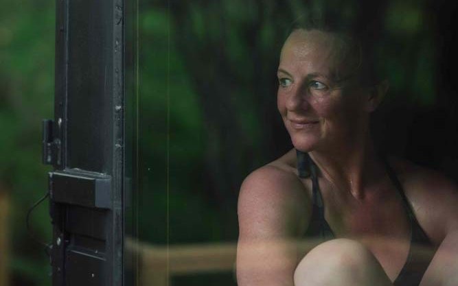 A person enjoying a sauna at Nowhere Sauna for hot cold water therapy